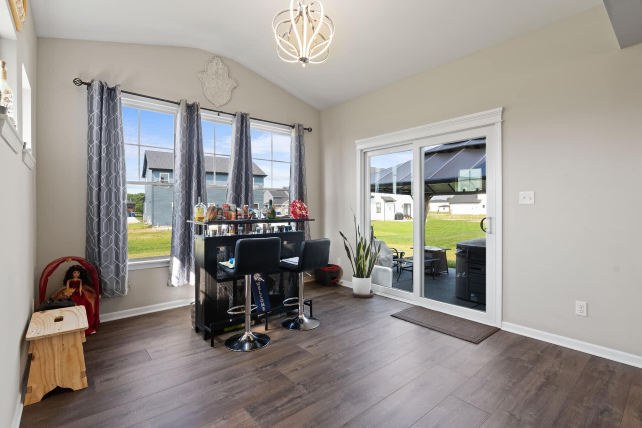 9872 Sumter Court Cedar Lake, IN 46303 - Photo 7 of 18 a view of a workspace with furniture and a window