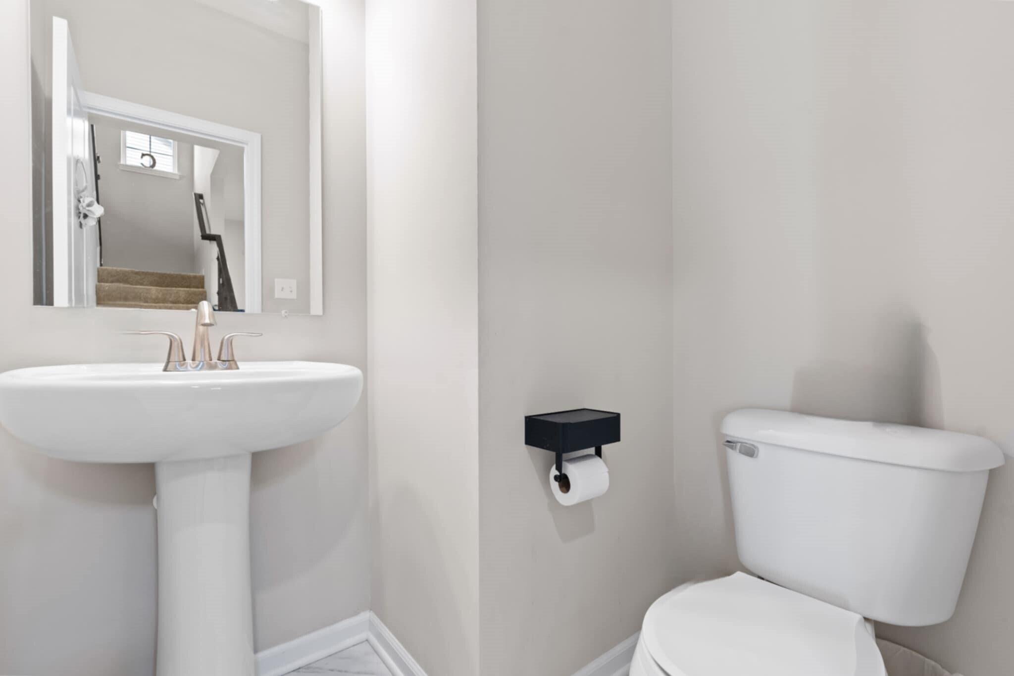 9872 Sumter Court Cedar Lake, IN 46303 - Photo 9 of 18 a bathroom with a toilet sink and mirror