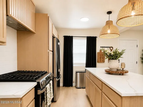 a kitchen with sink a stove and refrigerator