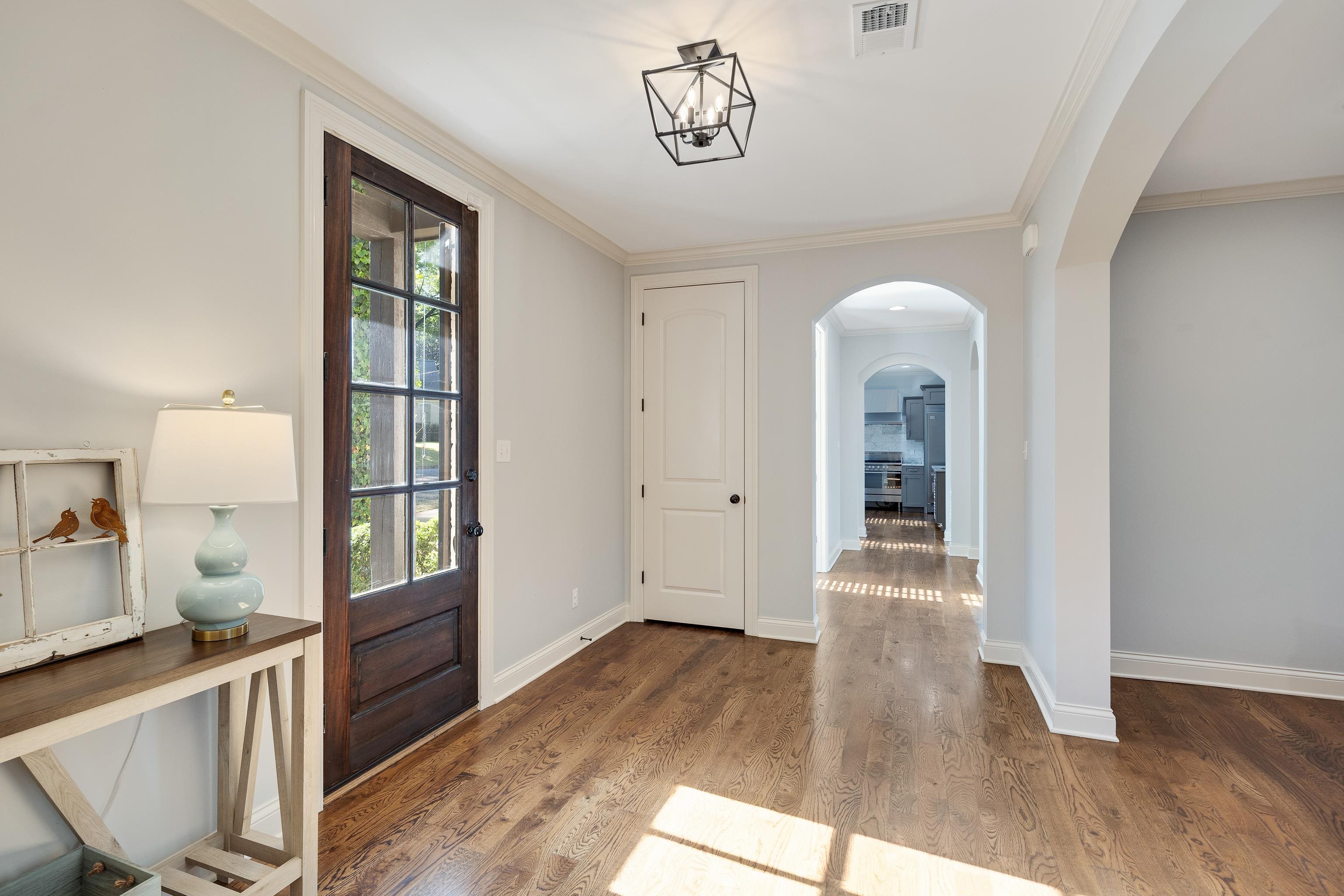 237 Windover Road Memphis, TN 38111 - Photo 8 of 37 Entrance foyer with ornamental molding, arched walkways, and light wood finished floors