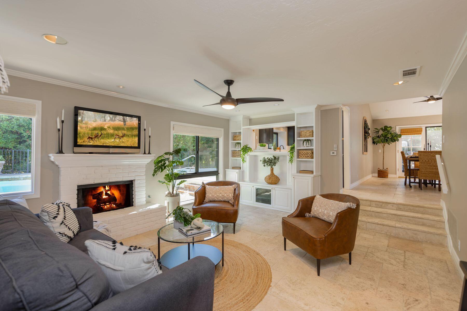 1270 Foothill Road Ojai, CA 93023 - Photo 16 of 47 a living room with furniture fireplace and a large window