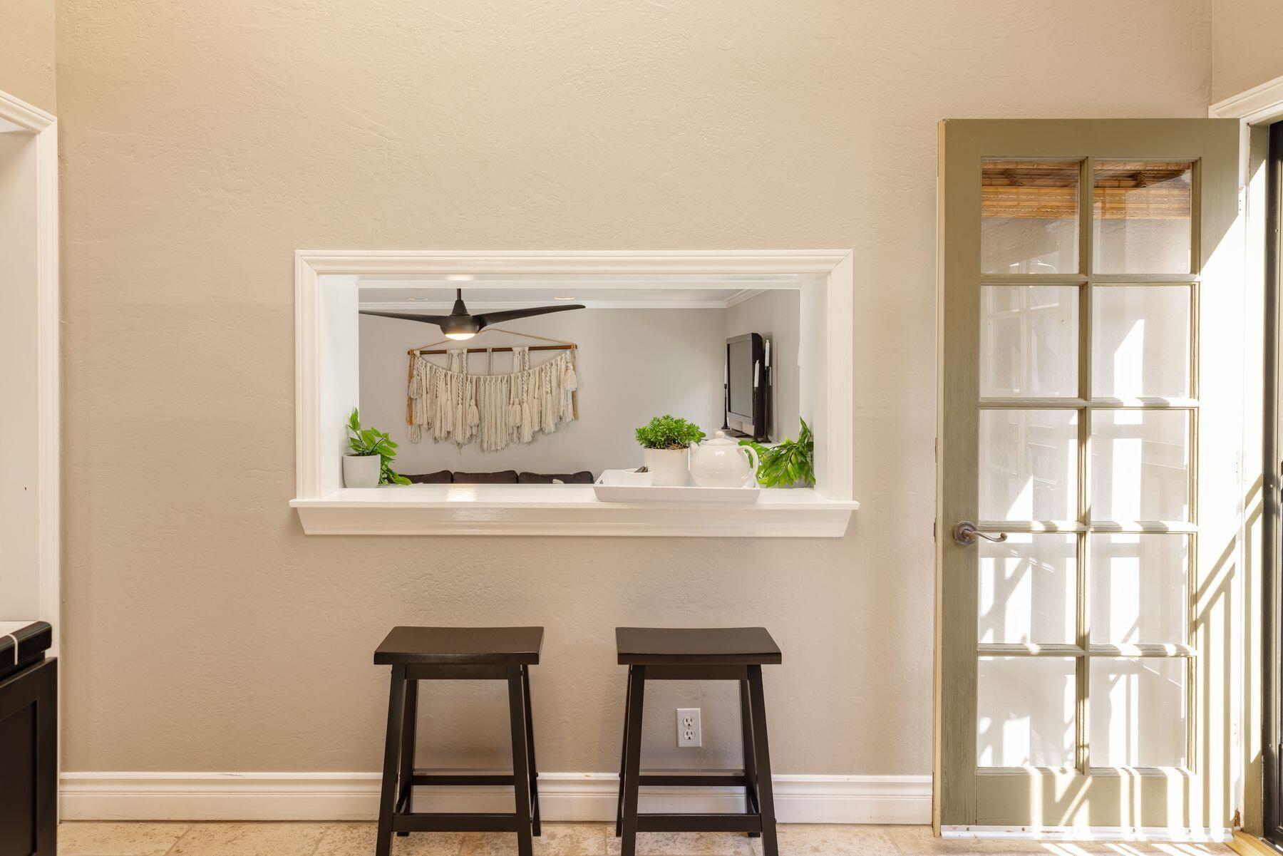 1270 Foothill Road Ojai, CA 93023 - Photo 29 of 47 a living room with a table and windows