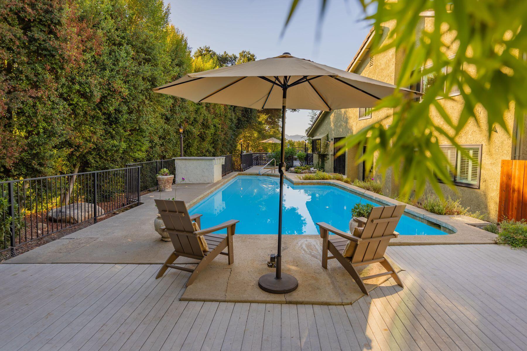 1270 Foothill Road Ojai, CA 93023 - Photo 36 of 47 a view of wooden chairs and table in the backyard