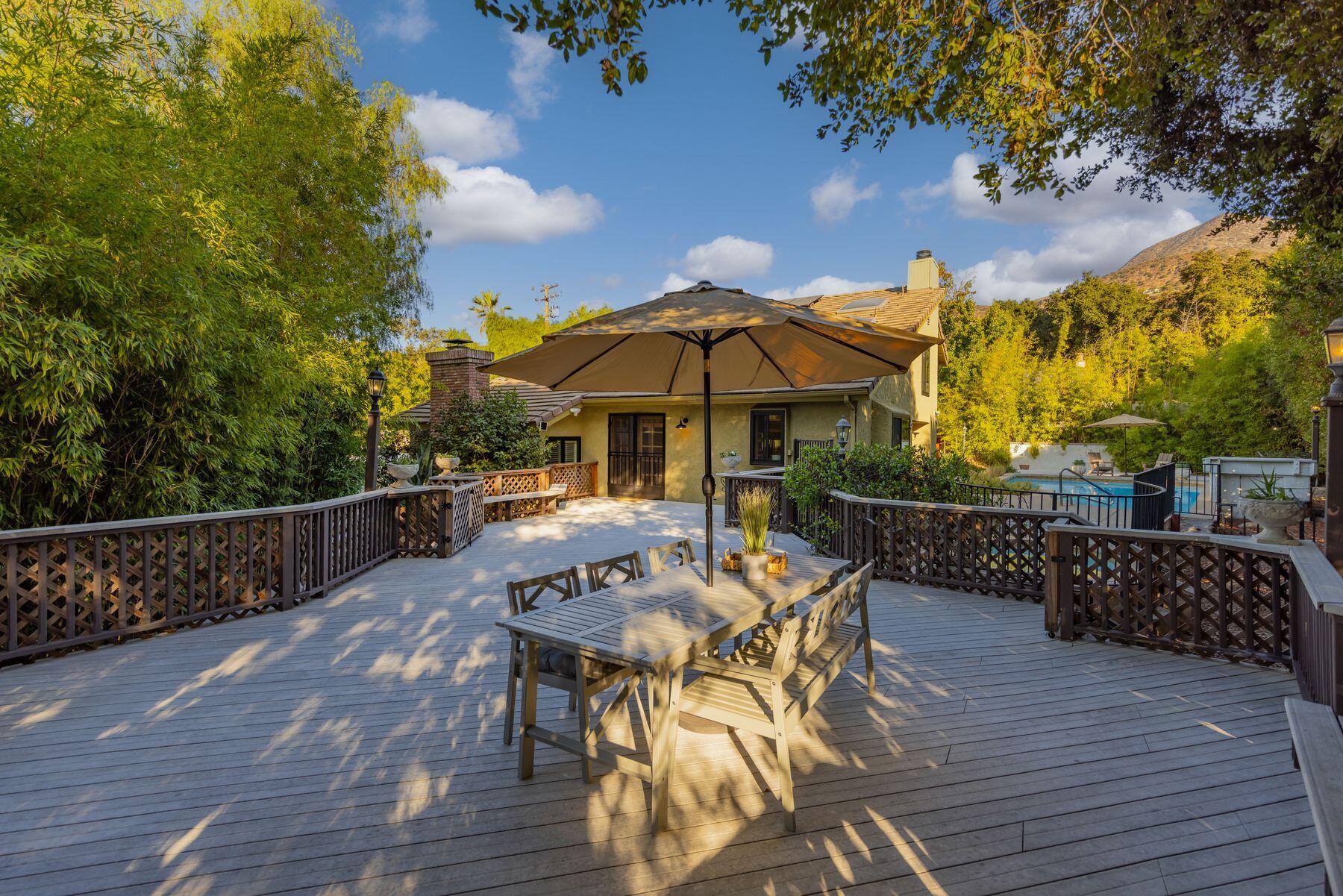 1270 Foothill Road Ojai, CA 93023 - Photo 38 of 47 a view of a patio with furniture and wooden floor