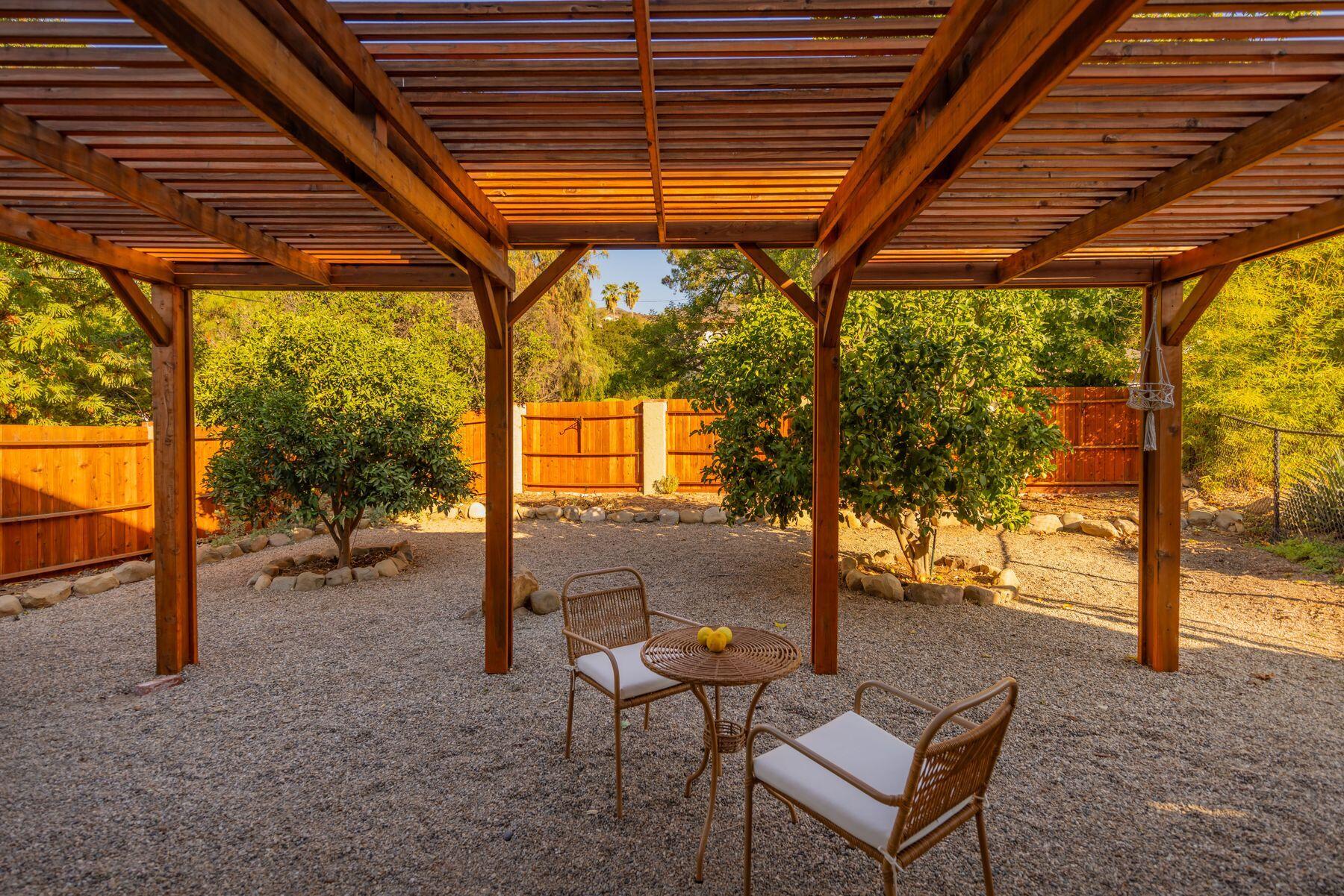 1270 Foothill Road Ojai, CA 93023 - Photo 6 of 47 a backyard of a house with table and chairs