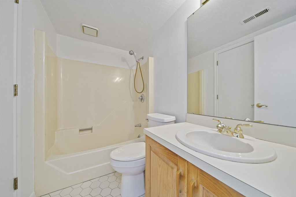 110 Burkhall Street, Unit H Weymouth, MA 02190 - Photo 11 of 18 a bathroom with a sink toilet and shower
