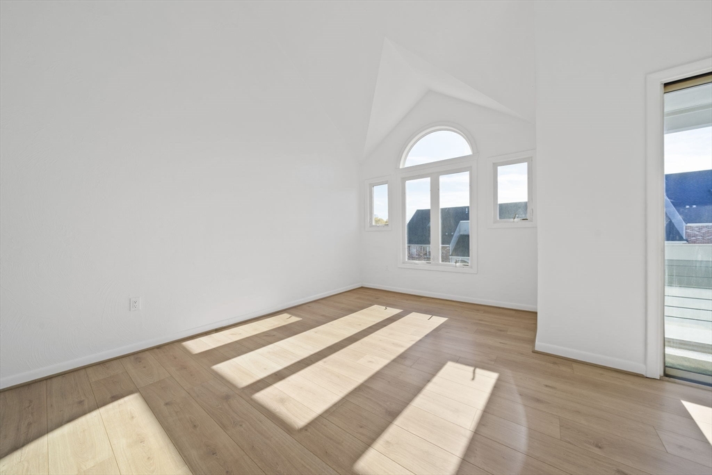 110 Burkhall Street, Unit H Weymouth, MA 02190 - Photo 5 of 18 a view of a room that has wooden floor and window