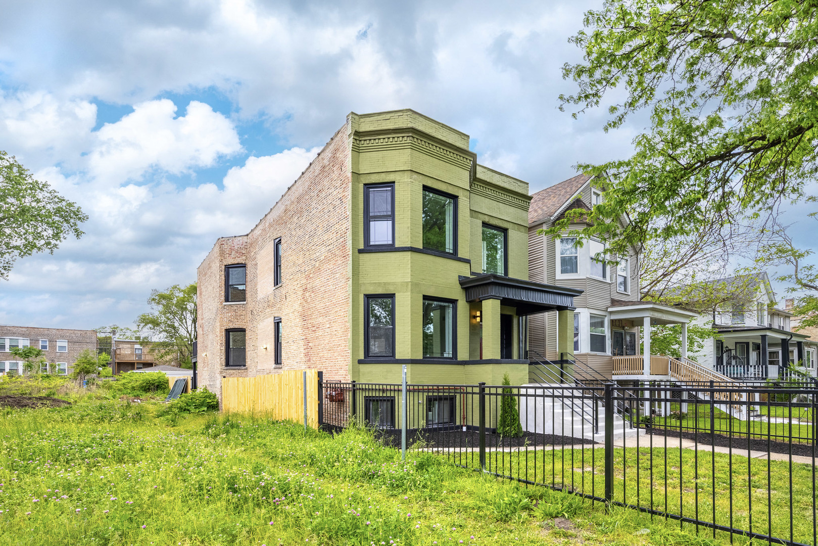 7232 South Union Avenue Chicago, IL 60621 - Photo 2 of 11 a front view of a house with a yard