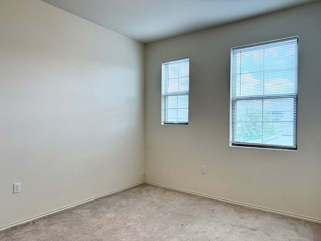 2015 Crimson Rosella Trail Austin, TX 78728 - Photo 14 of 20 Carpeted empty room featuring plenty of natural light
