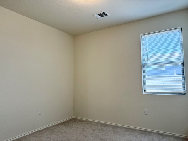 2015 Crimson Rosella Trail Austin, TX 78728 - Photo 19 of 20 Carpeted spare room featuring baseboards