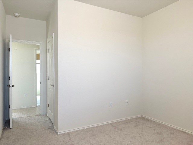 2015 Crimson Rosella Trail Austin, TX 78728 - Photo 20 of 20 Unfurnished room with light colored carpet