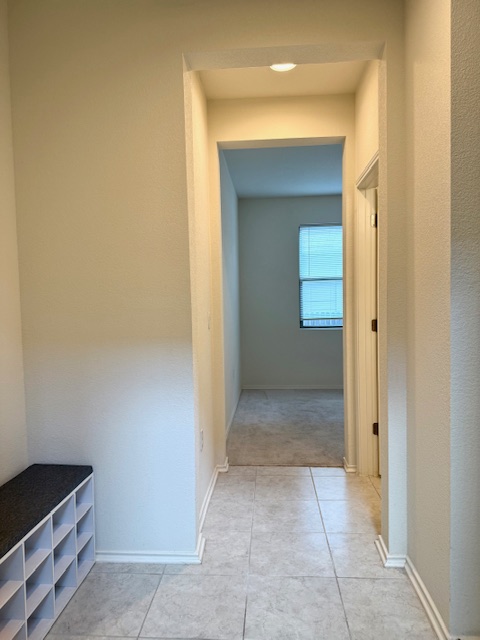 2015 Crimson Rosella Trail Austin, TX 78728 - Photo 10 of 20 Corridor featuring light tile patterned floors