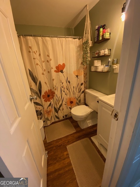 1102 Williams Lane Elberton, GA 30635 - Photo 14 of 36 a bathroom with a toilet and shower curtain