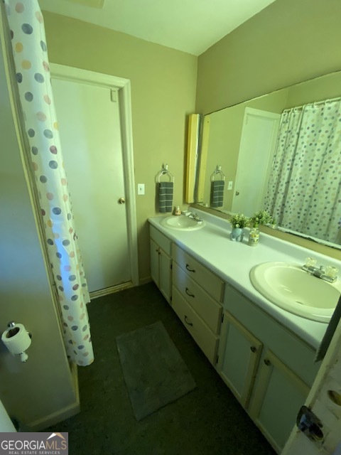 1102 Williams Lane Elberton, GA 30635 - Photo 19 of 36 a bathroom with a double vanity sink and a mirror
