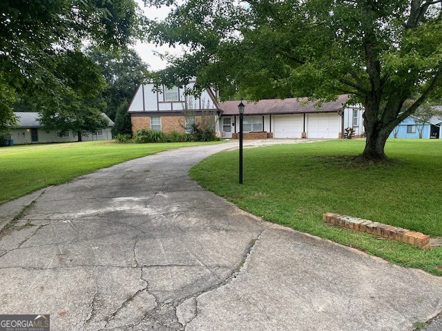 1102 Williams Lane Elberton, GA 30635 - Photo 3 of 36 a front view of a house with a garden and trees