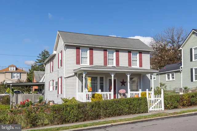 front view of a house with a small yard
