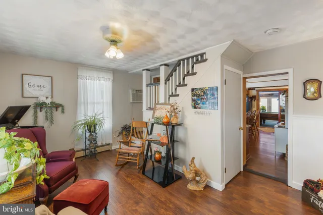 a dining room with furniture a window and kitchen view
