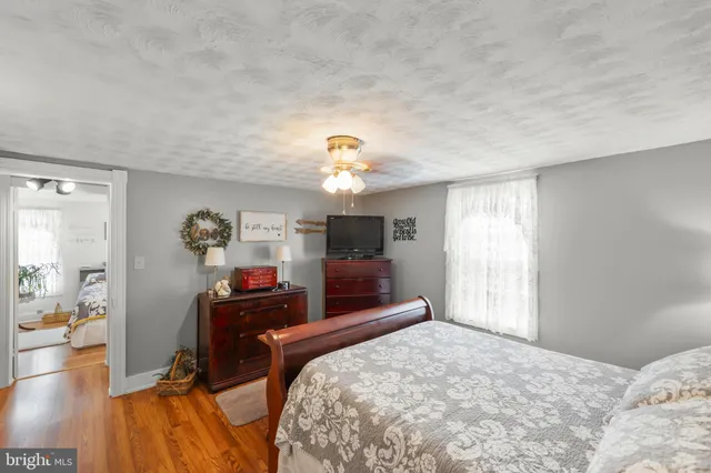 a bedroom with furniture and a bed