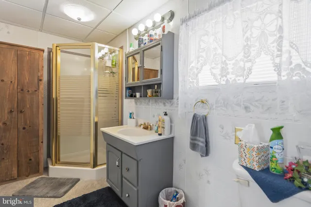 a bedroom with bed and a window