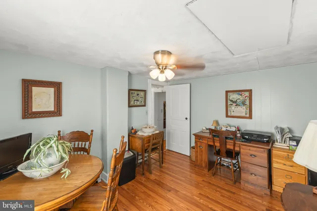 a view of a porch with furniture and floor to ceiling window