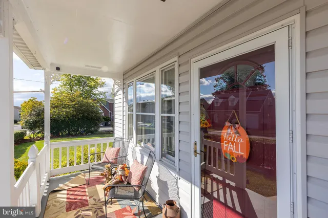 a view of a room with furniture and a chandelier