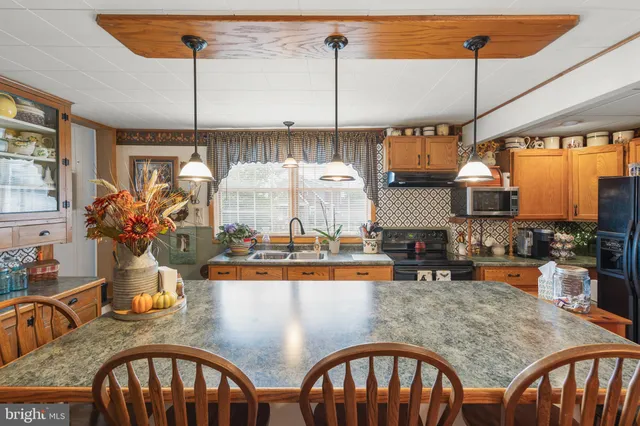 a dinning table and chairs in a kitchen