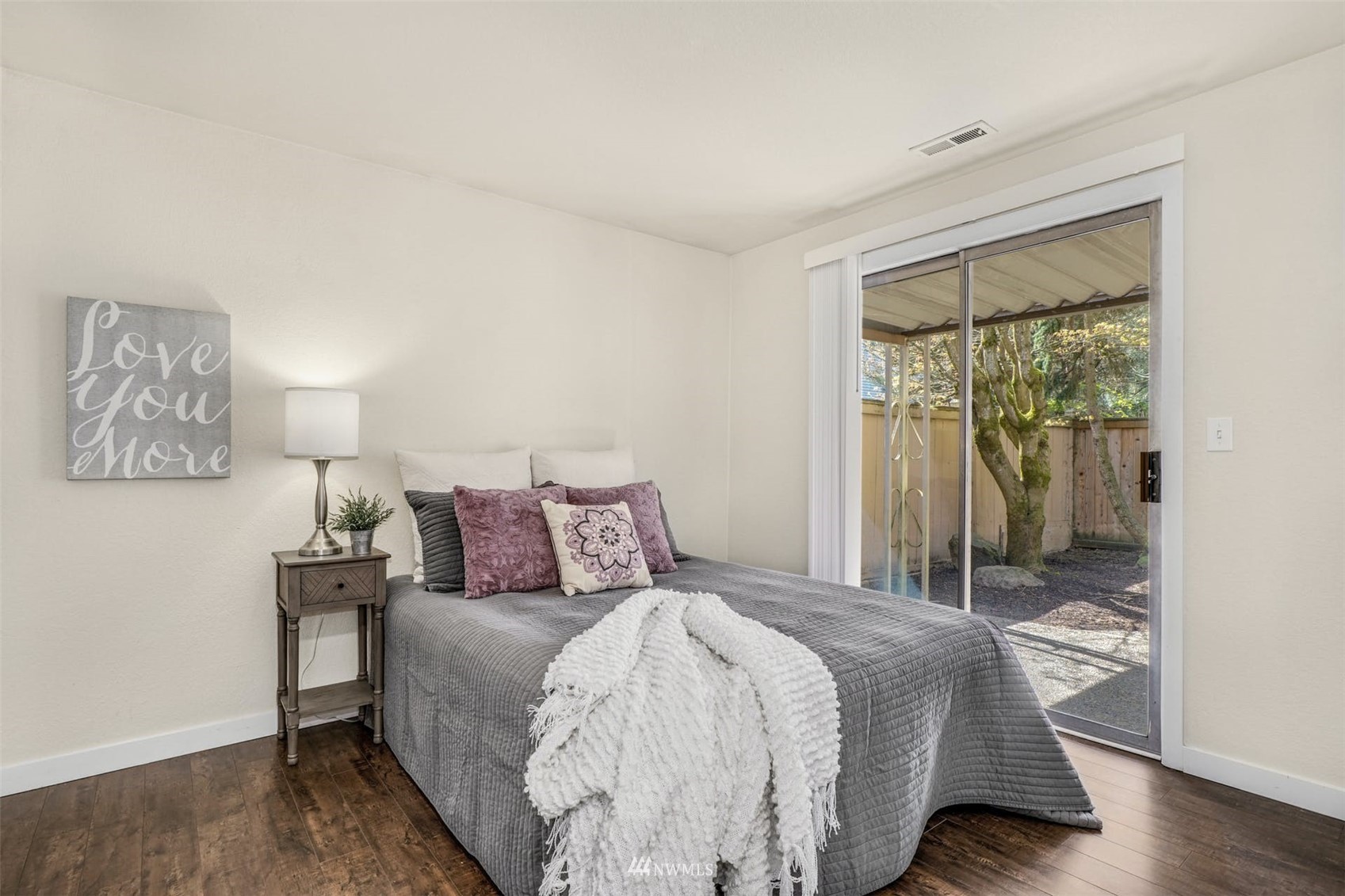 9103 183rd Avenue Northeast Redmond, WA 98052 - Photo 15 of 25 a bed sitting in a bedroom next to a window