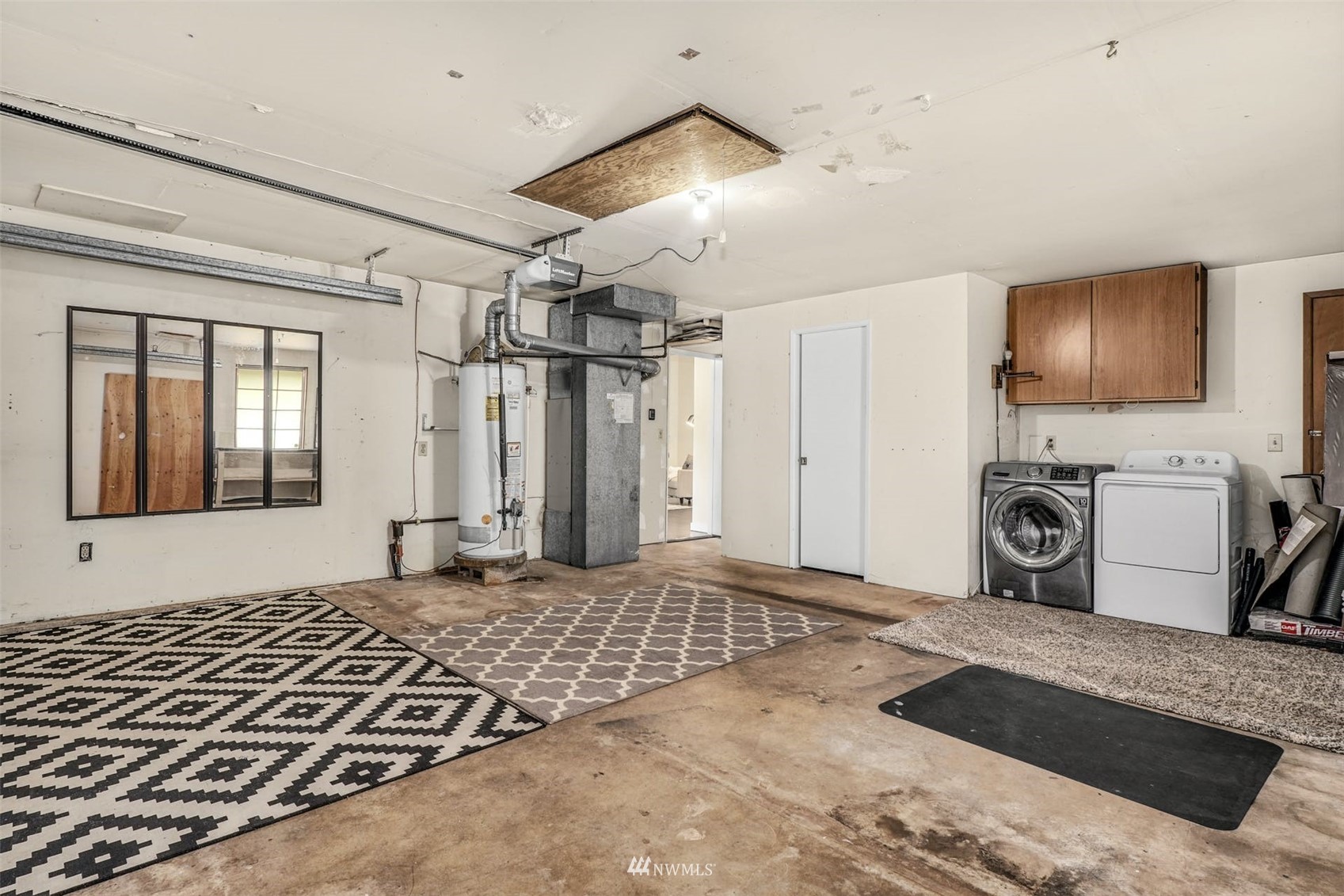 9103 183rd Avenue Northeast Redmond, WA 98052 - Photo 17 of 25 a bedroom with a bed and a flat screen tv