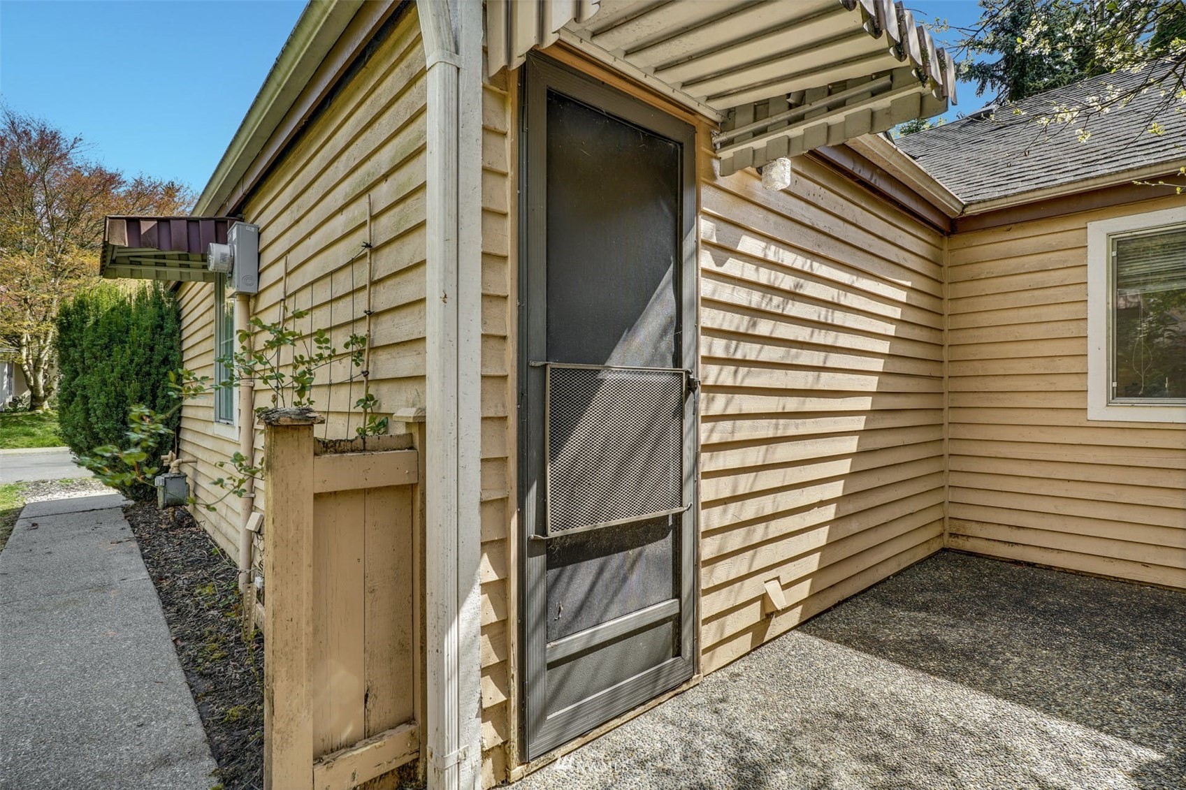 9103 183rd Avenue Northeast Redmond, WA 98052 - Photo 19 of 25 a view of a house with a door and a window