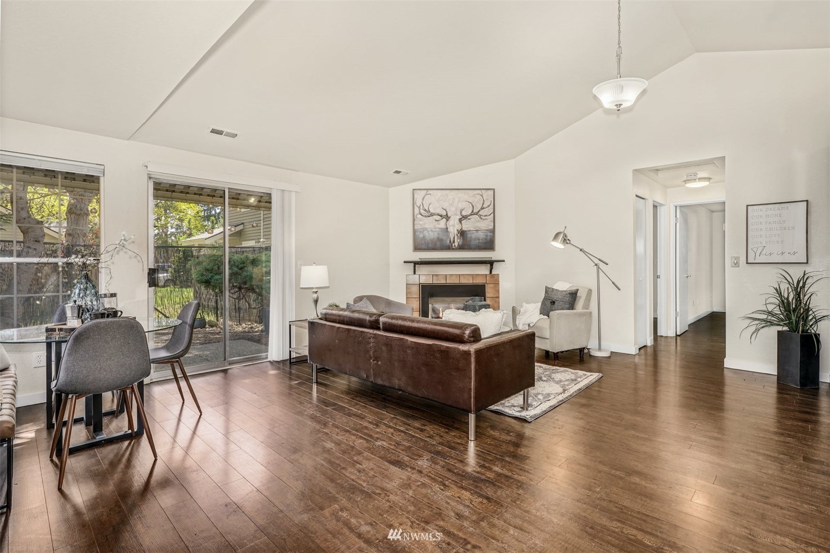9103 183rd Avenue Northeast Redmond, WA 98052 - Photo 4 of 25 a living room with furniture and a wooden floor