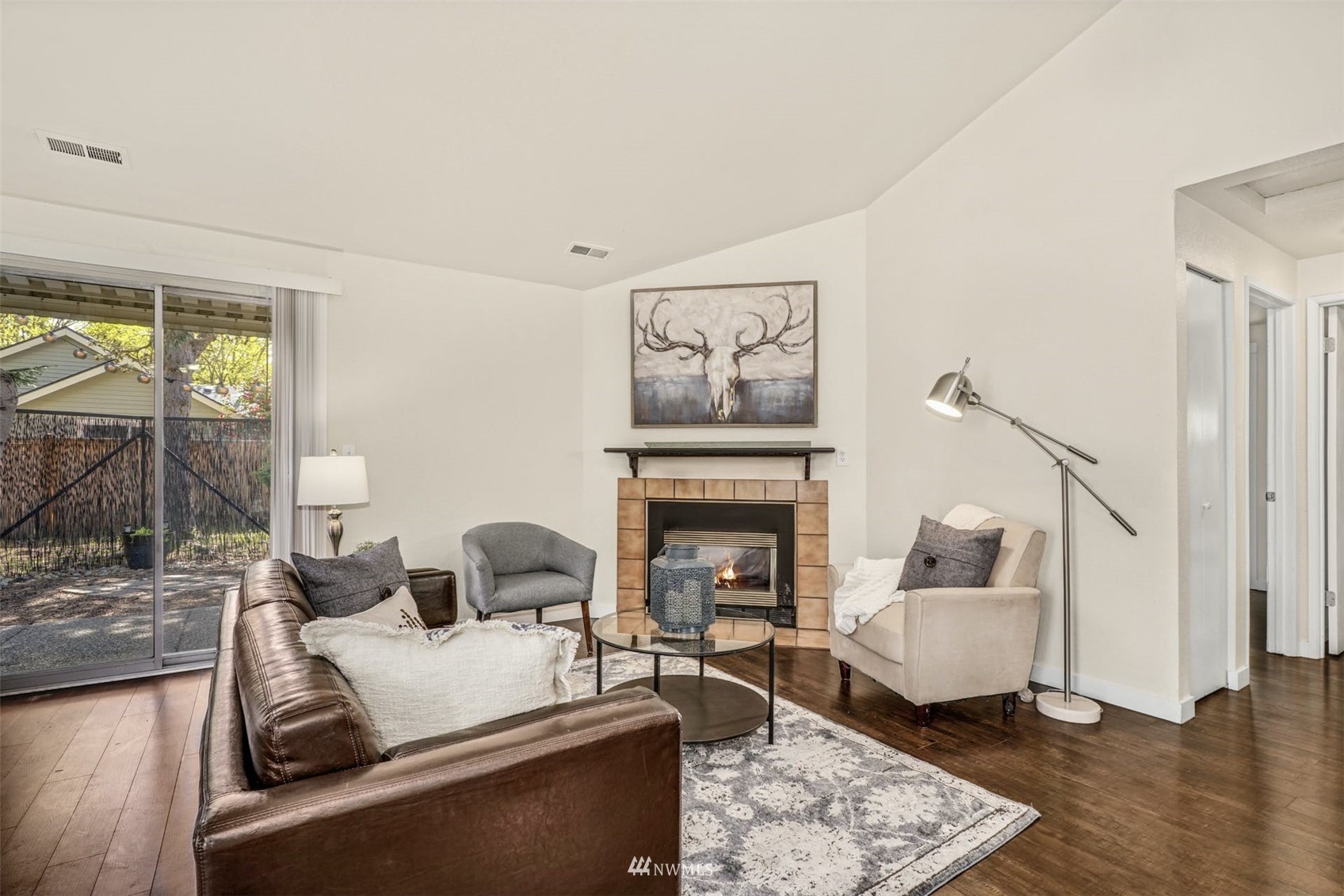 9103 183rd Avenue Northeast Redmond, WA 98052 - Photo 5 of 25 a living room with furniture and a fireplace