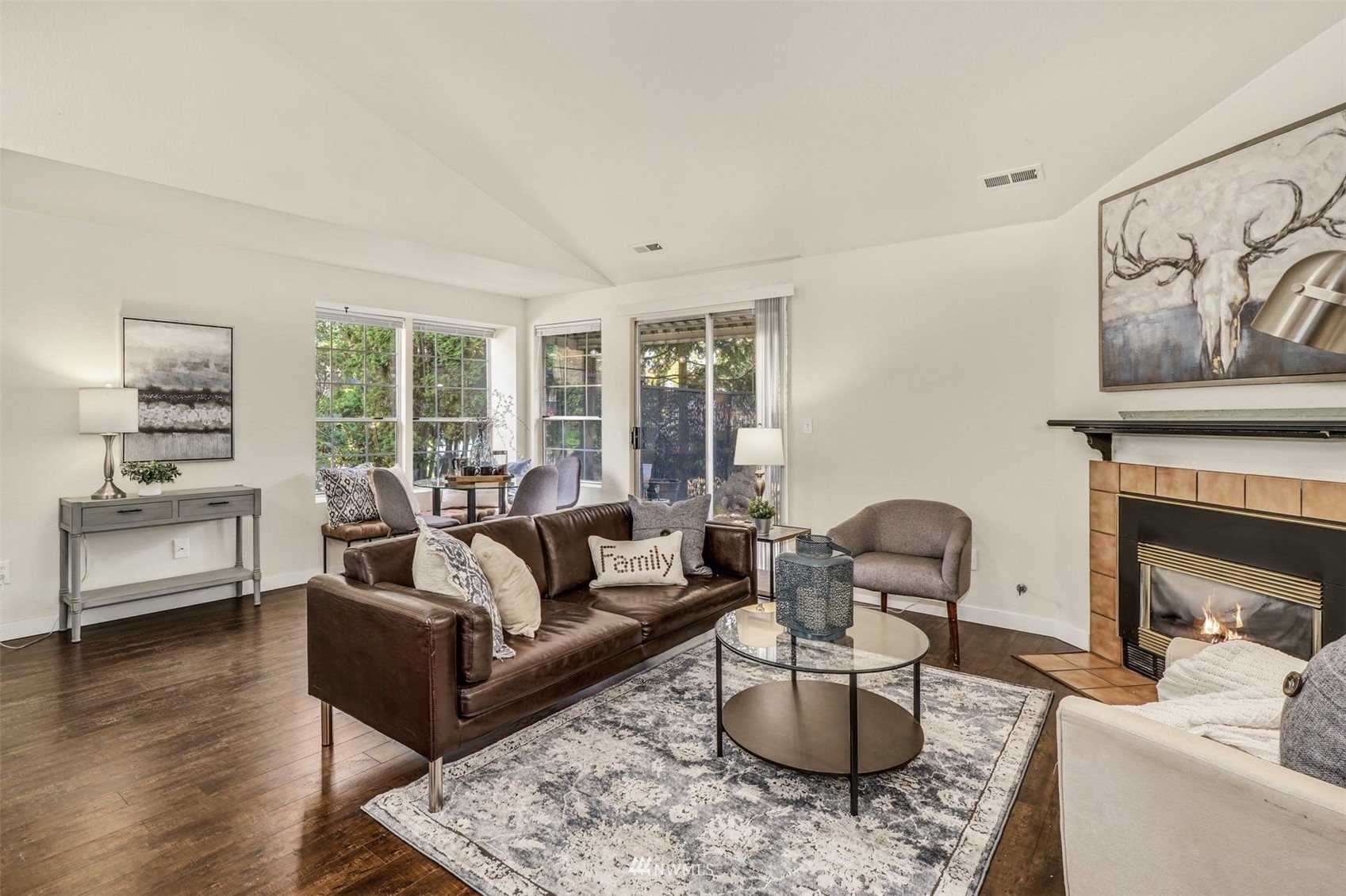 9103 183rd Avenue Northeast Redmond, WA 98052 - Photo 7 of 25 a living room with furniture and a fireplace