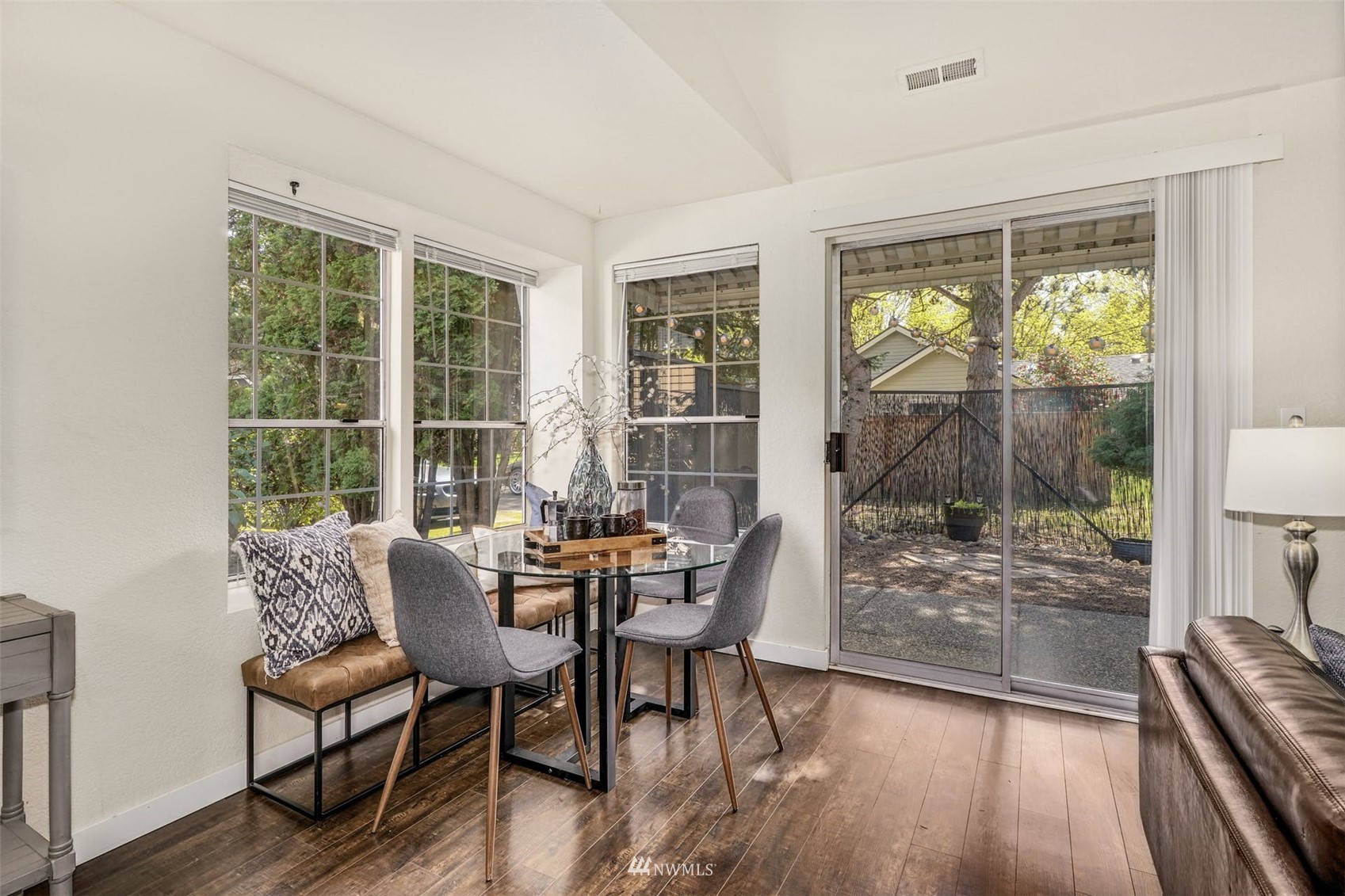 9103 183rd Avenue Northeast Redmond, WA 98052 - Photo 8 of 25 a dining room with furniture and wooden floor
