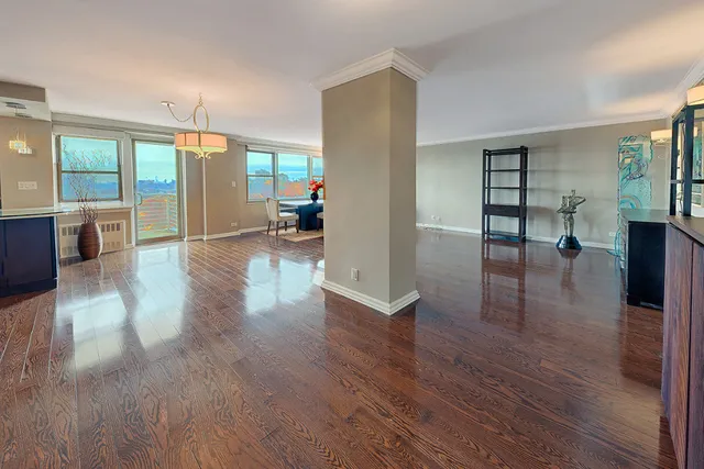 a view of livingroom with furniture wooden floor and windows