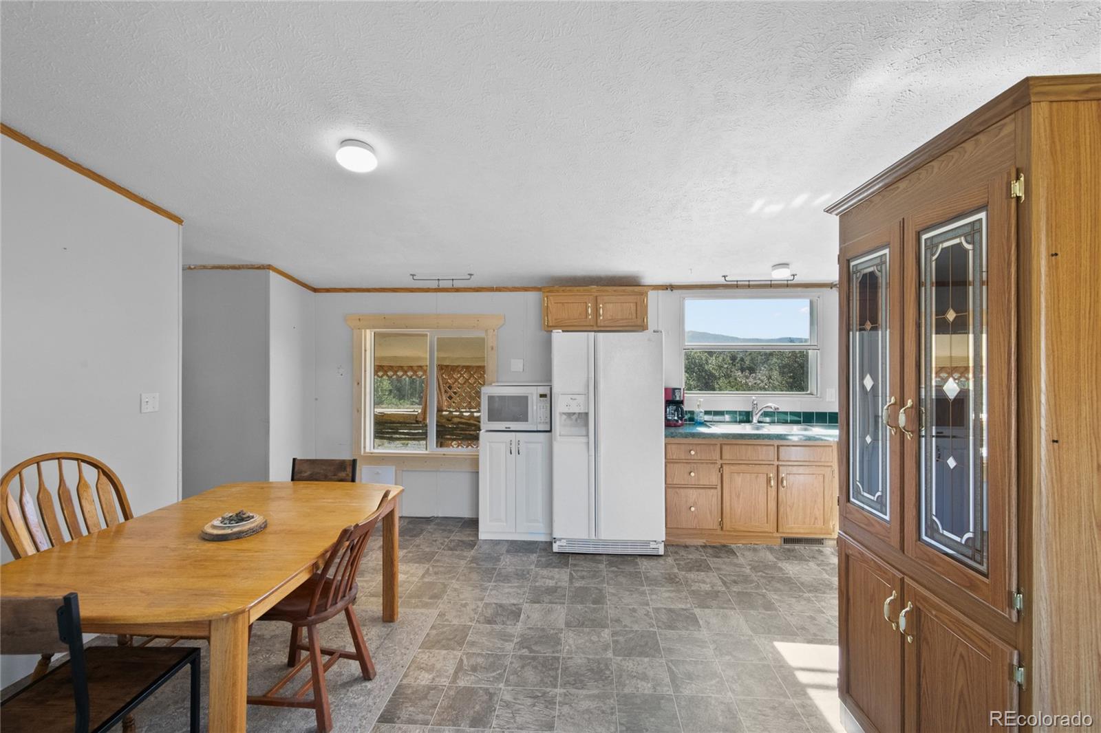 7027 Frelinghuysen Road Fort Garland, CO 81133 - Photo 16 of 47 a view of a kitchen and an empty room