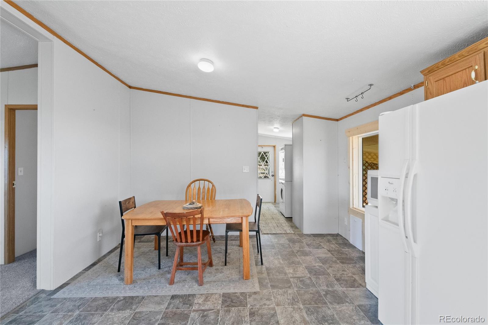 7027 Frelinghuysen Road Fort Garland, CO 81133 - Photo 19 of 47 a view of a dining room with furniture