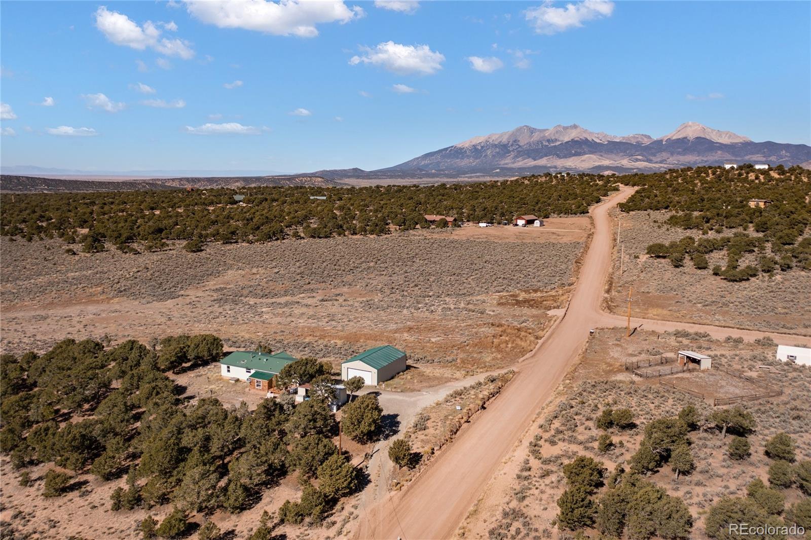 7027 Frelinghuysen Road Fort Garland, CO 81133 - Photo 3 of 47 a view of a lake with mountains in the background