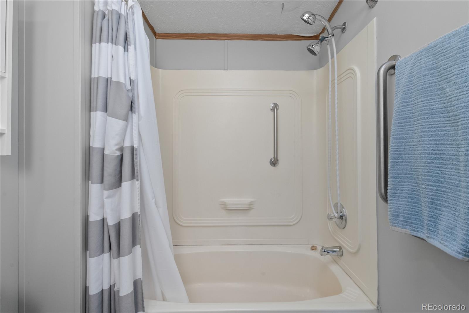 7027 Frelinghuysen Road Fort Garland, CO 81133 - Photo 33 of 47 a bathroom with a shower