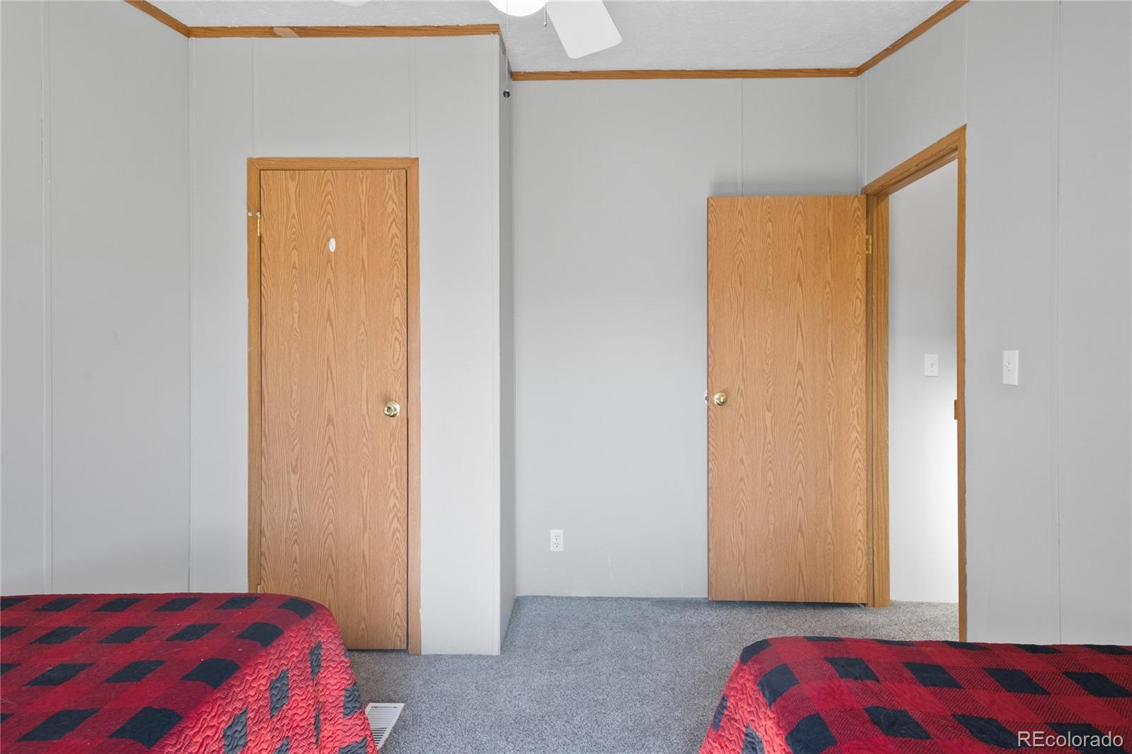 7027 Frelinghuysen Road Fort Garland, CO 81133 - Photo 35 of 47 a bedroom with a bed and a closet