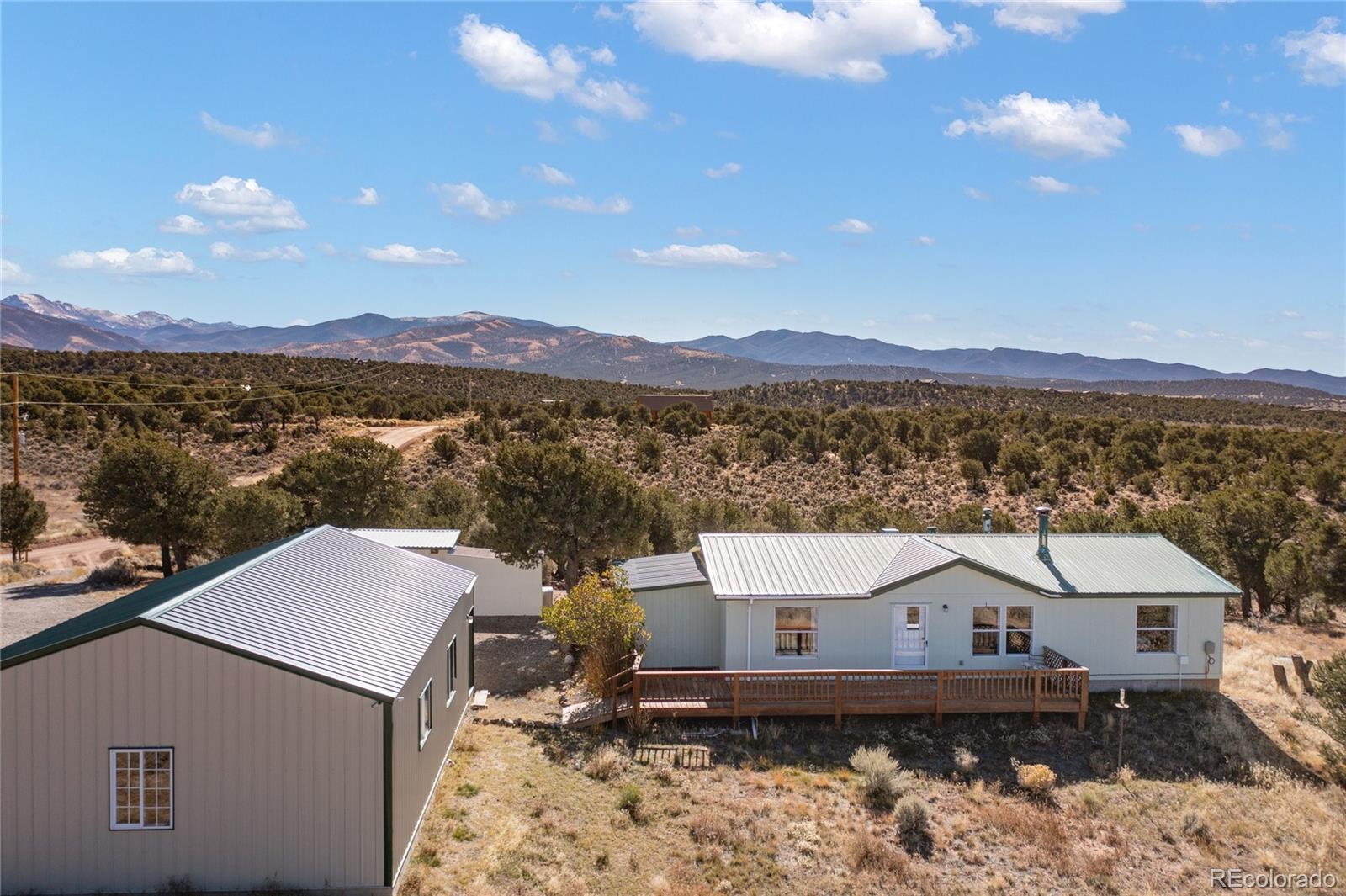 7027 Frelinghuysen Road Fort Garland, CO 81133 - Photo 4 of 47 a view of a house with a mountain