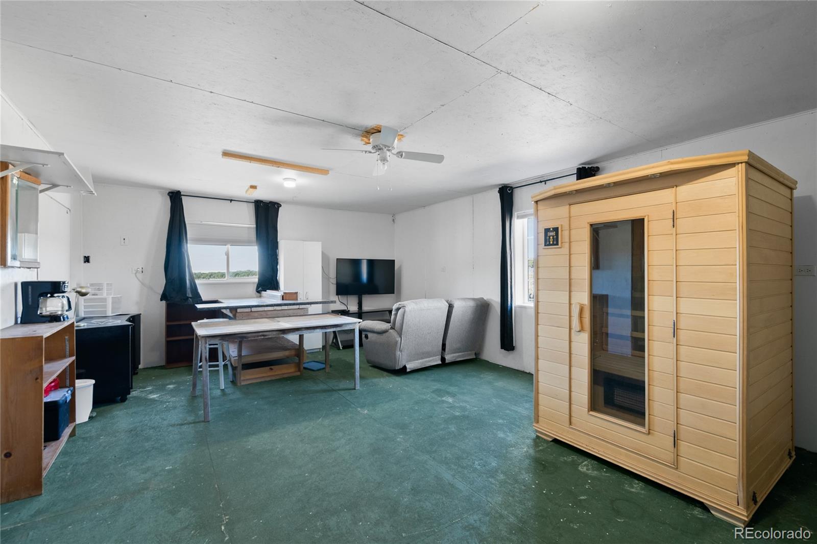 7027 Frelinghuysen Road Fort Garland, CO 81133 - Photo 44 of 47 a view of a livingroom with furniture and windows
