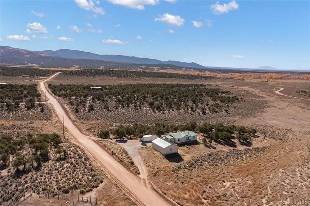 a view of a mountain with a mountain and trees