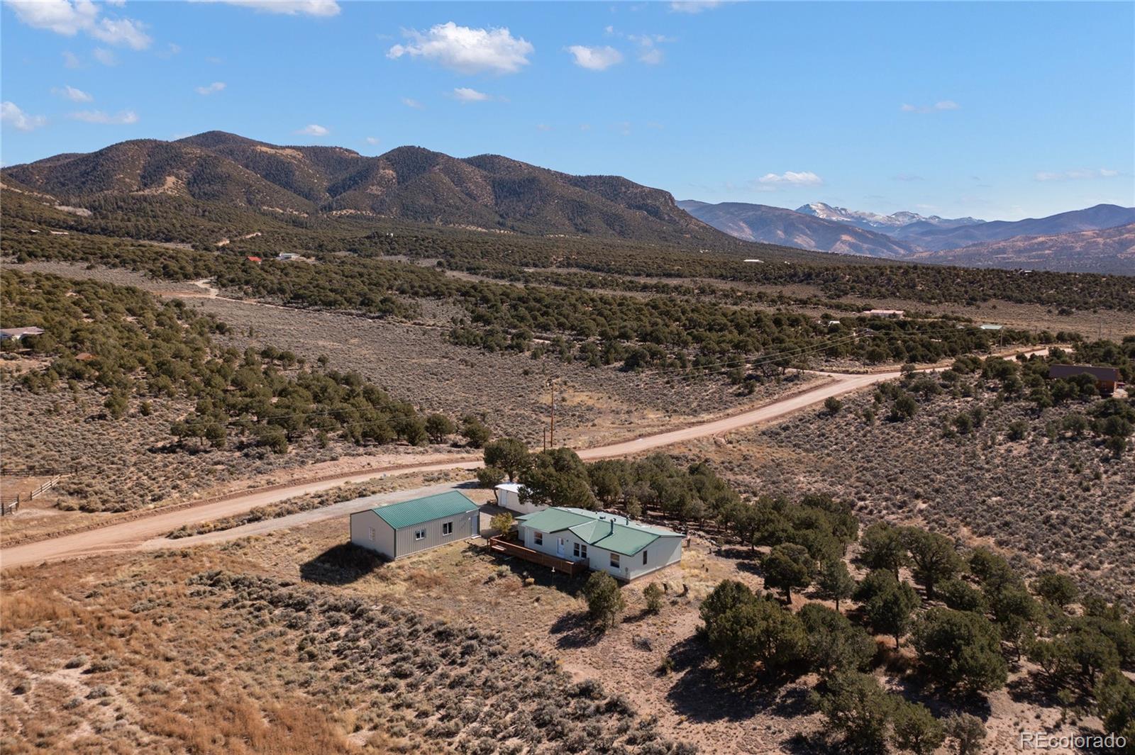 7027 Frelinghuysen Road Fort Garland, CO 81133 - Photo 6 of 47 a view of a mountain with a mountain and trees