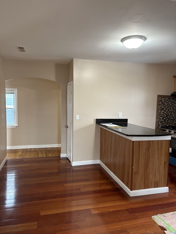 14 B School, Unit 2 Boston, MA 02124 - Photo 1 of 18 a view of an empty room with wooden floor