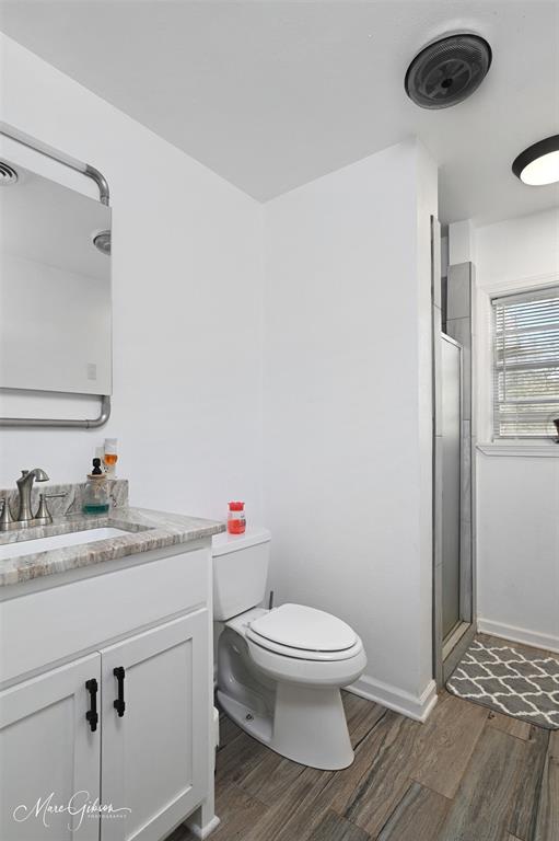 135 Poverty Point Doyline, LA 71023 - Photo 11 of 24 a white toilet sitting next to a bathroom sink