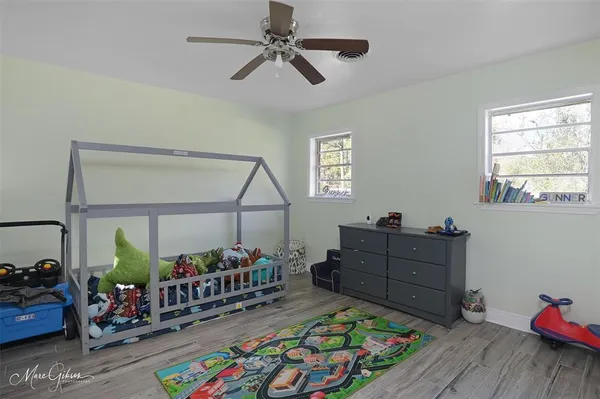 a bed room with furniture and a window