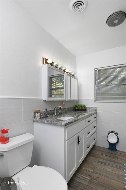 135 Poverty Point Doyline, LA 71023 - Photo 14 of 24 a bathroom with a granite countertop toilet sink and mirror