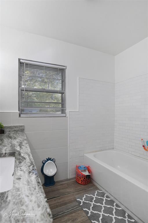 135 Poverty Point Doyline, LA 71023 - Photo 15 of 24 a bathroom with a granite countertop bathtub and sink