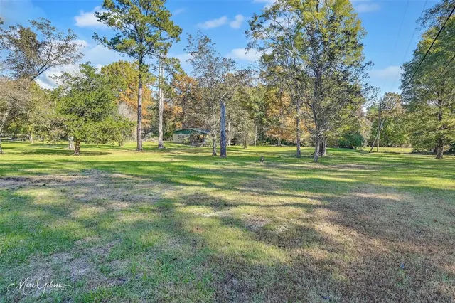 a view of a house with a big yard