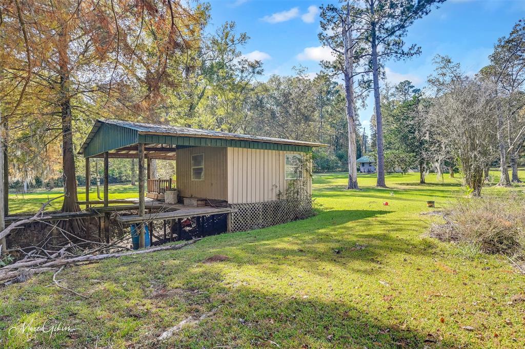 135 Poverty Point Doyline, LA 71023 - Photo 21 of 24 a view of a house with backyard and a tree